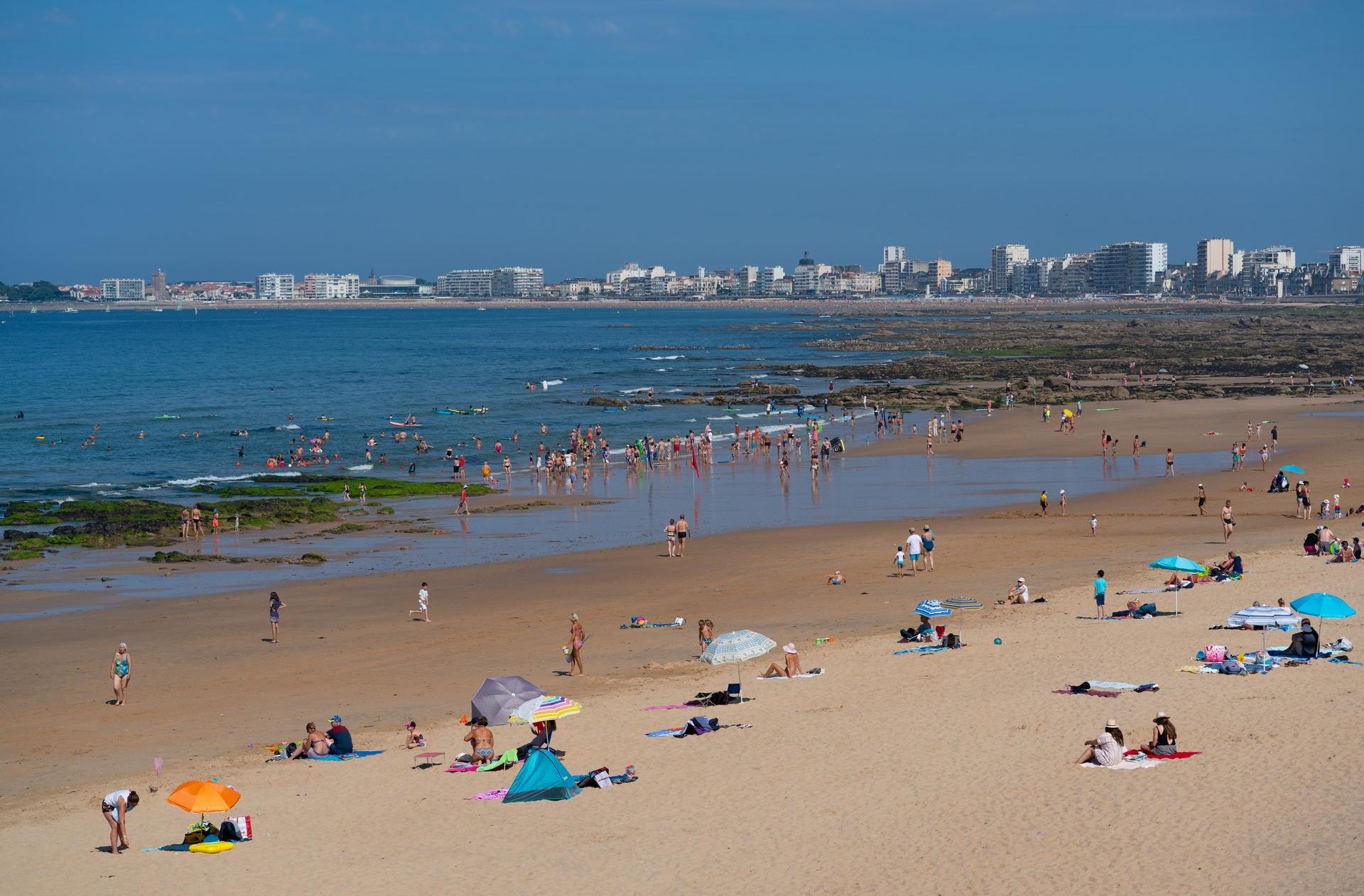 Aerial view of beach with a lot of people in Les Sables-d'Olonne with nice weather and blue sky