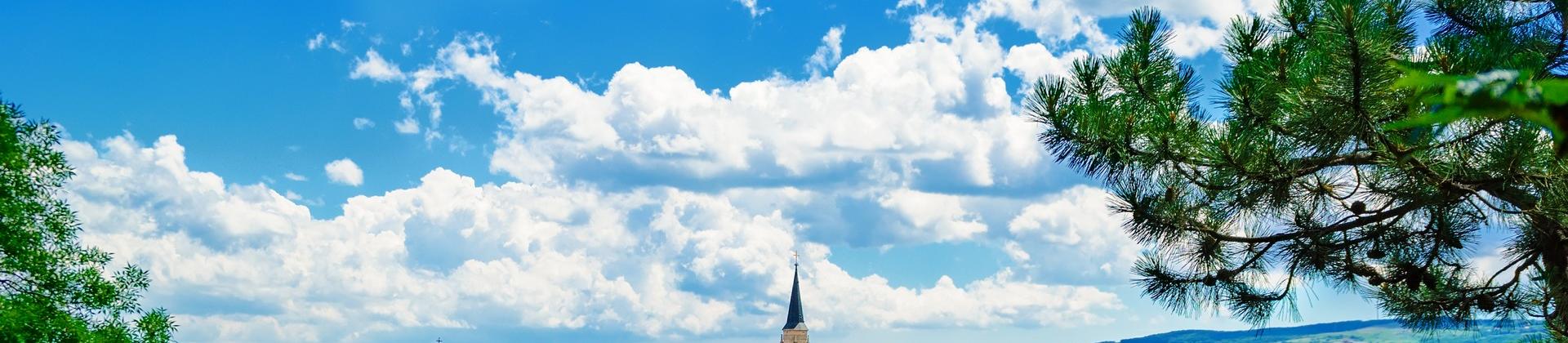 Aerial view of architecture in Cluj-Napoca in sunny weather with few clouds