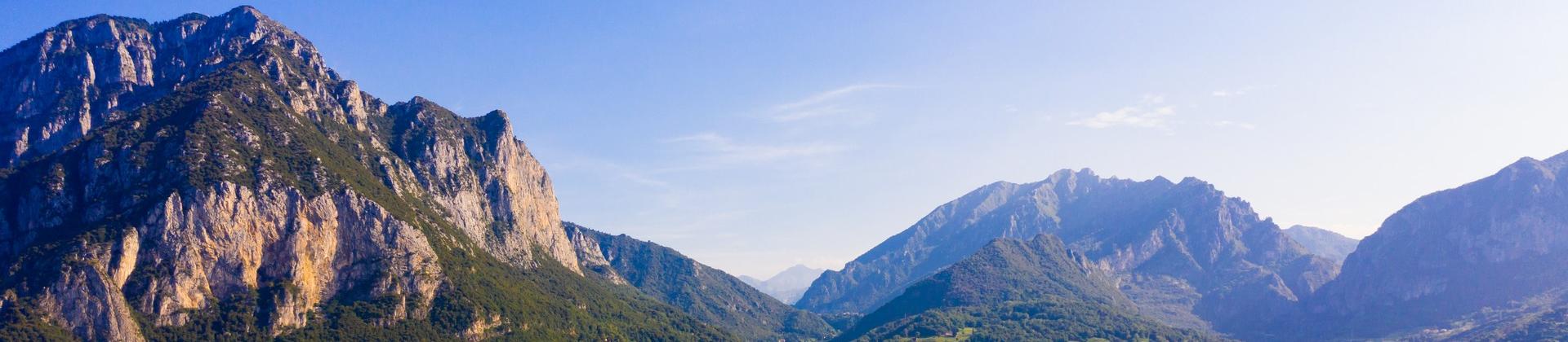 Aerial view of mountain range in Lecco in partly cloudy weather