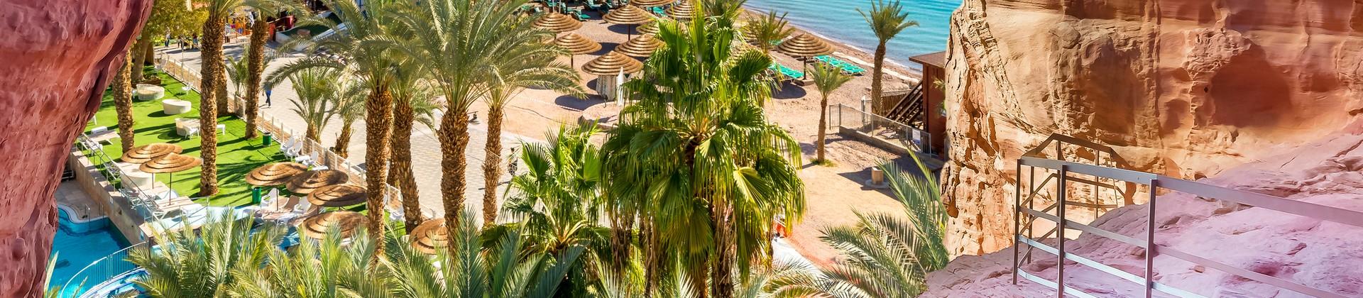 Beach and mountain range in Eilat in partly cloudy weather