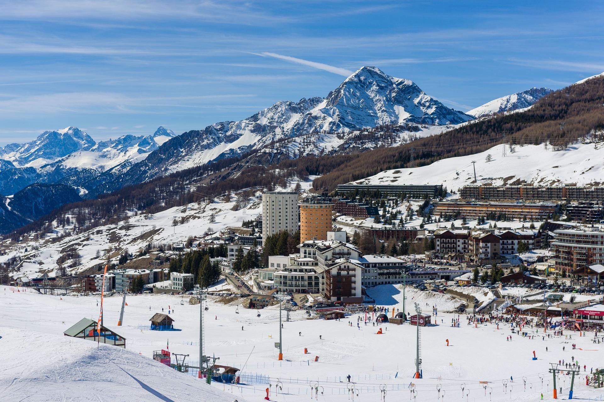 Mountain range in Sestriere in sunny weather with few clouds