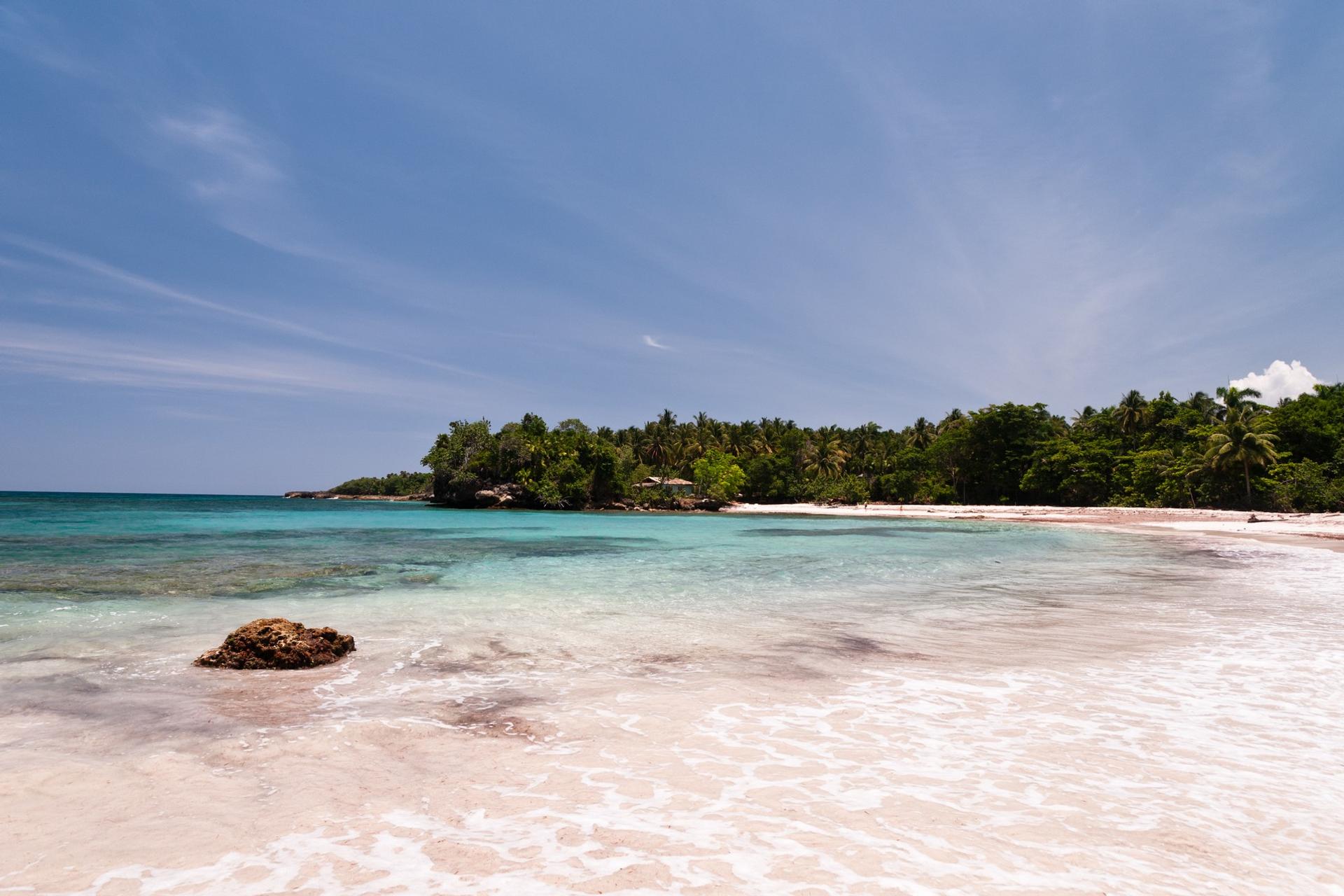 Beach with turquise sea near Baracoa in partly cloudy weather