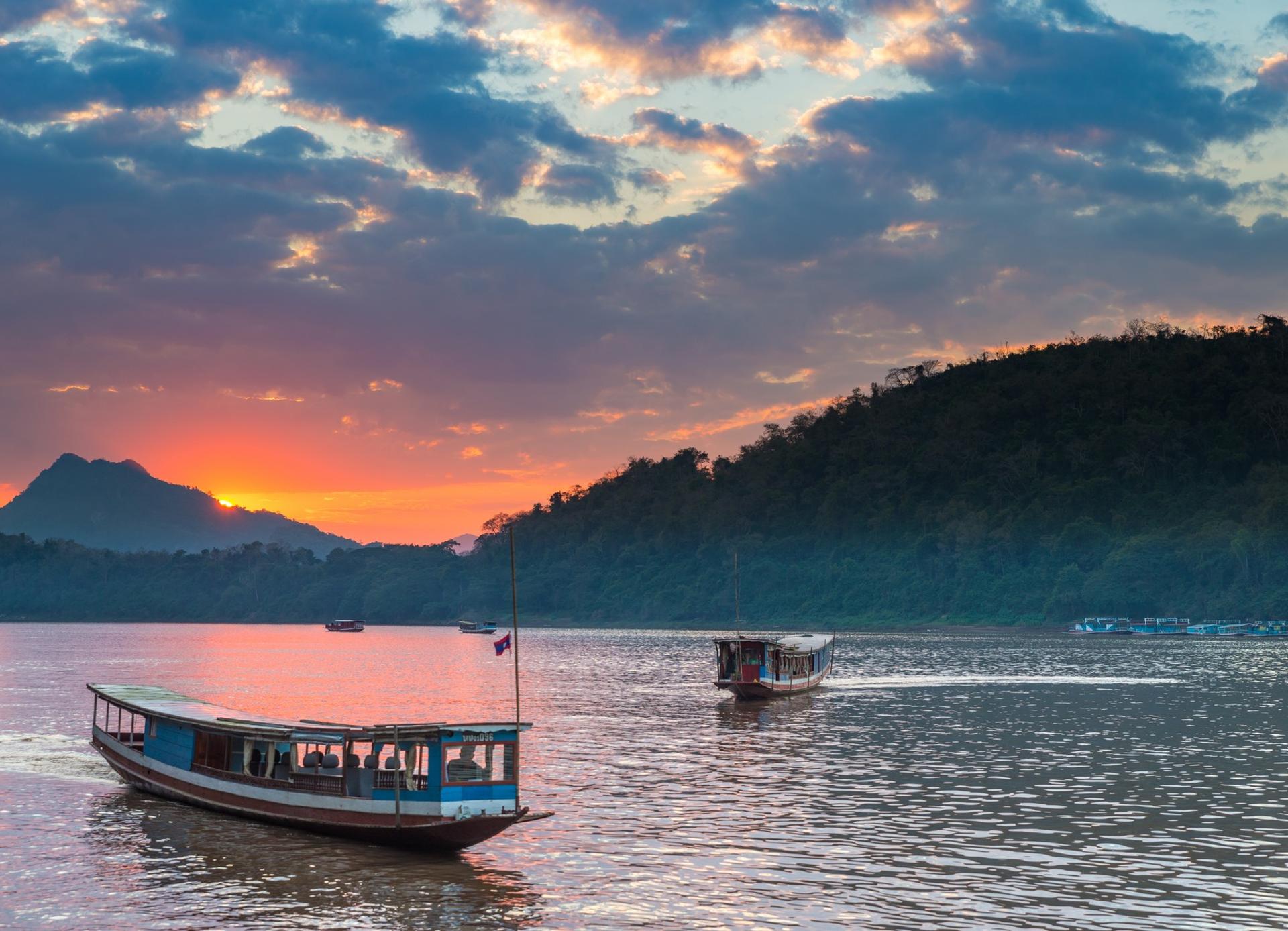 Boat near Louangphrabang at sunset time