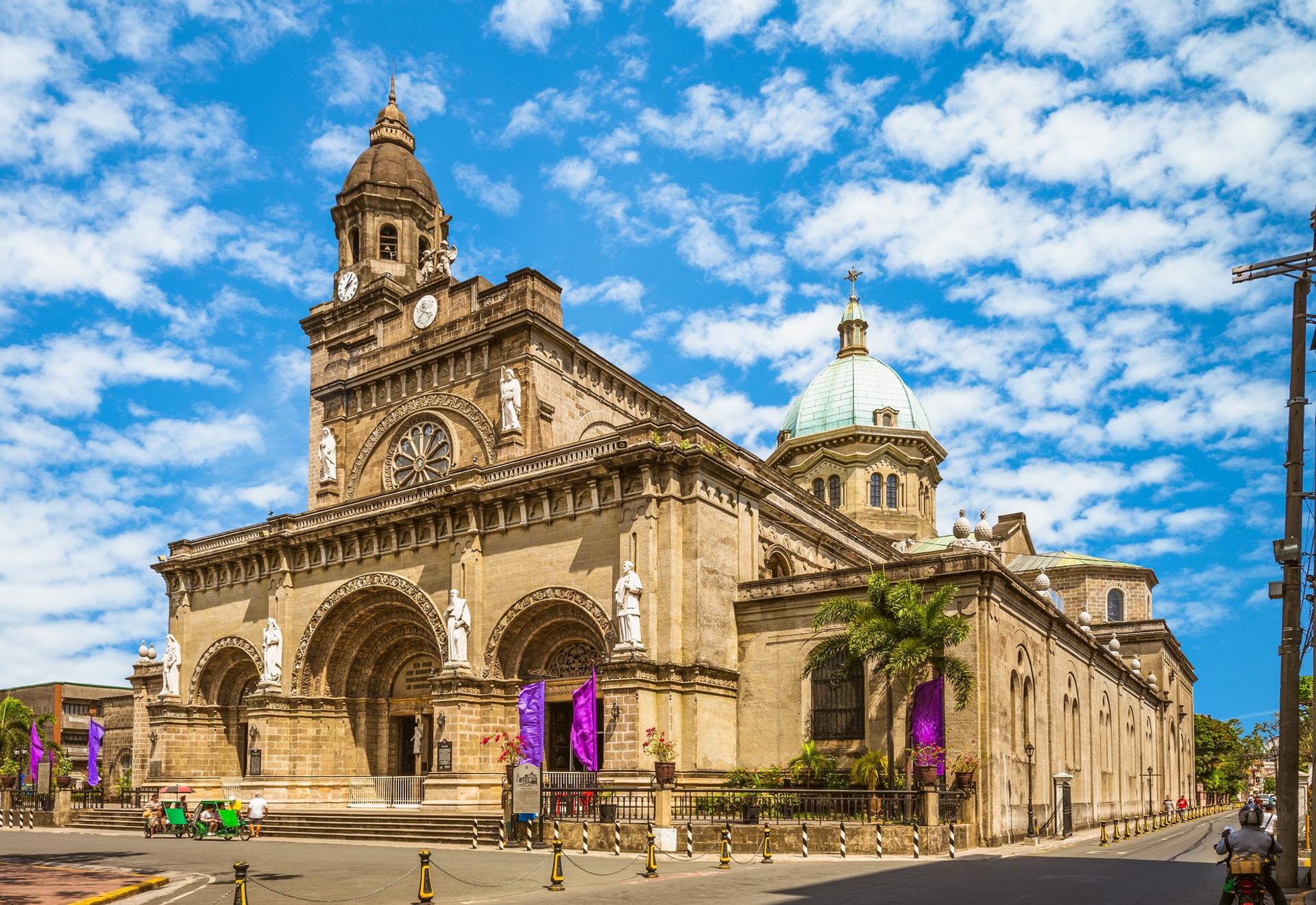 Architecture in Manila in sunny weather with few clouds