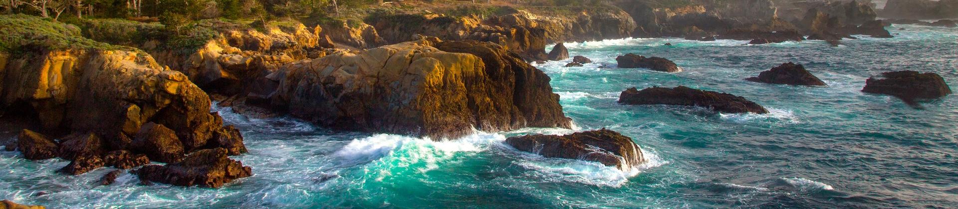 Location near Carmel-by-the-Sea on a sunny day with some clouds