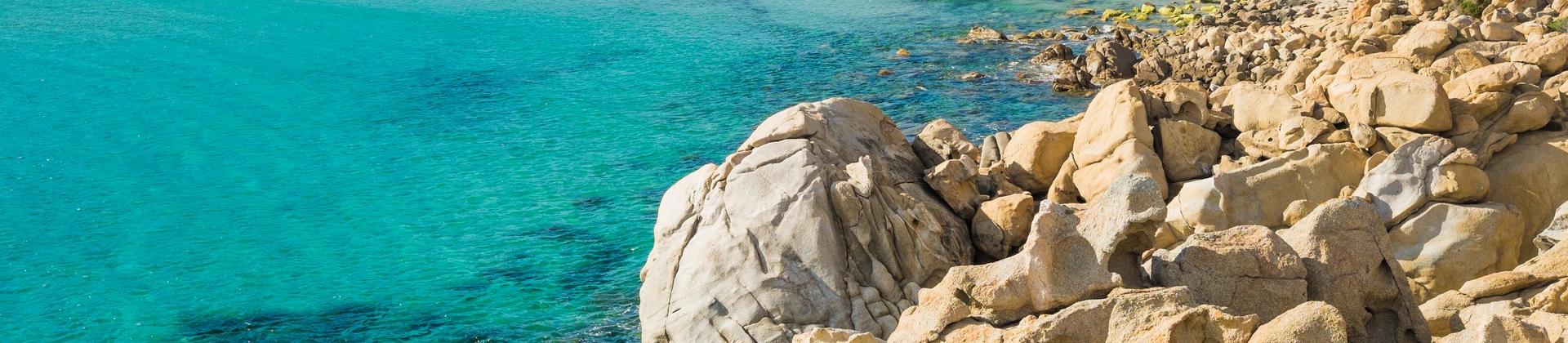 Amazing beach with turquise water near Chia in partly cloudy weather