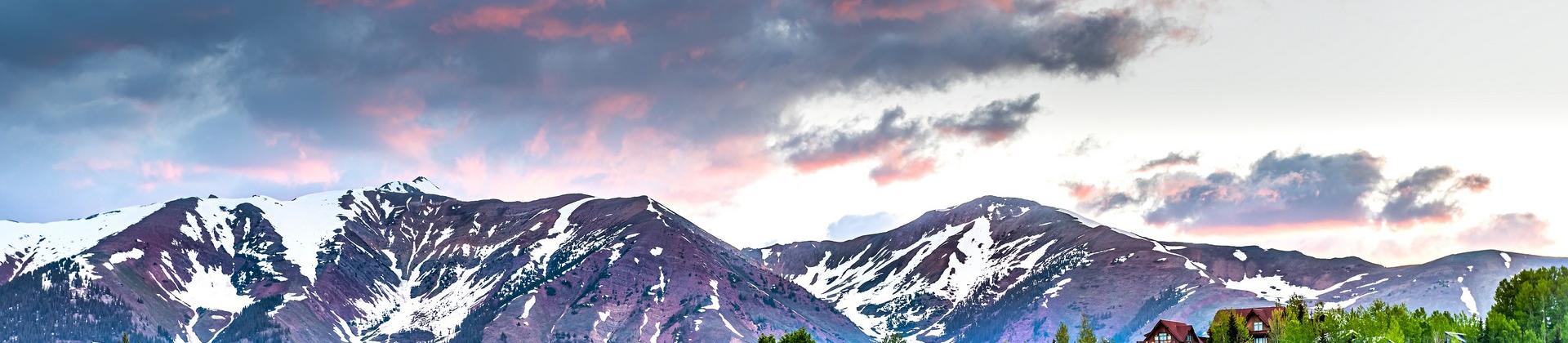 Mountain range in Crested Butte in sunny weather with few clouds