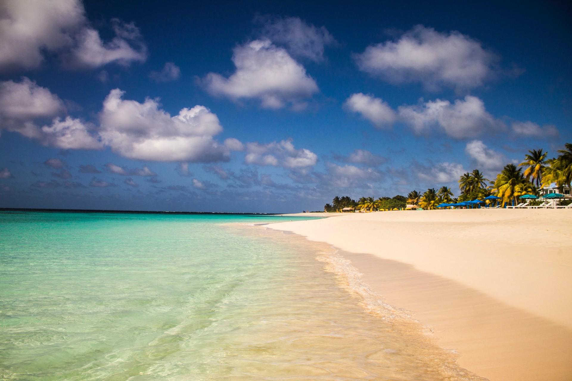 Nice beach by the sea with turquise water in Anguilla in sunny weather with few clouds