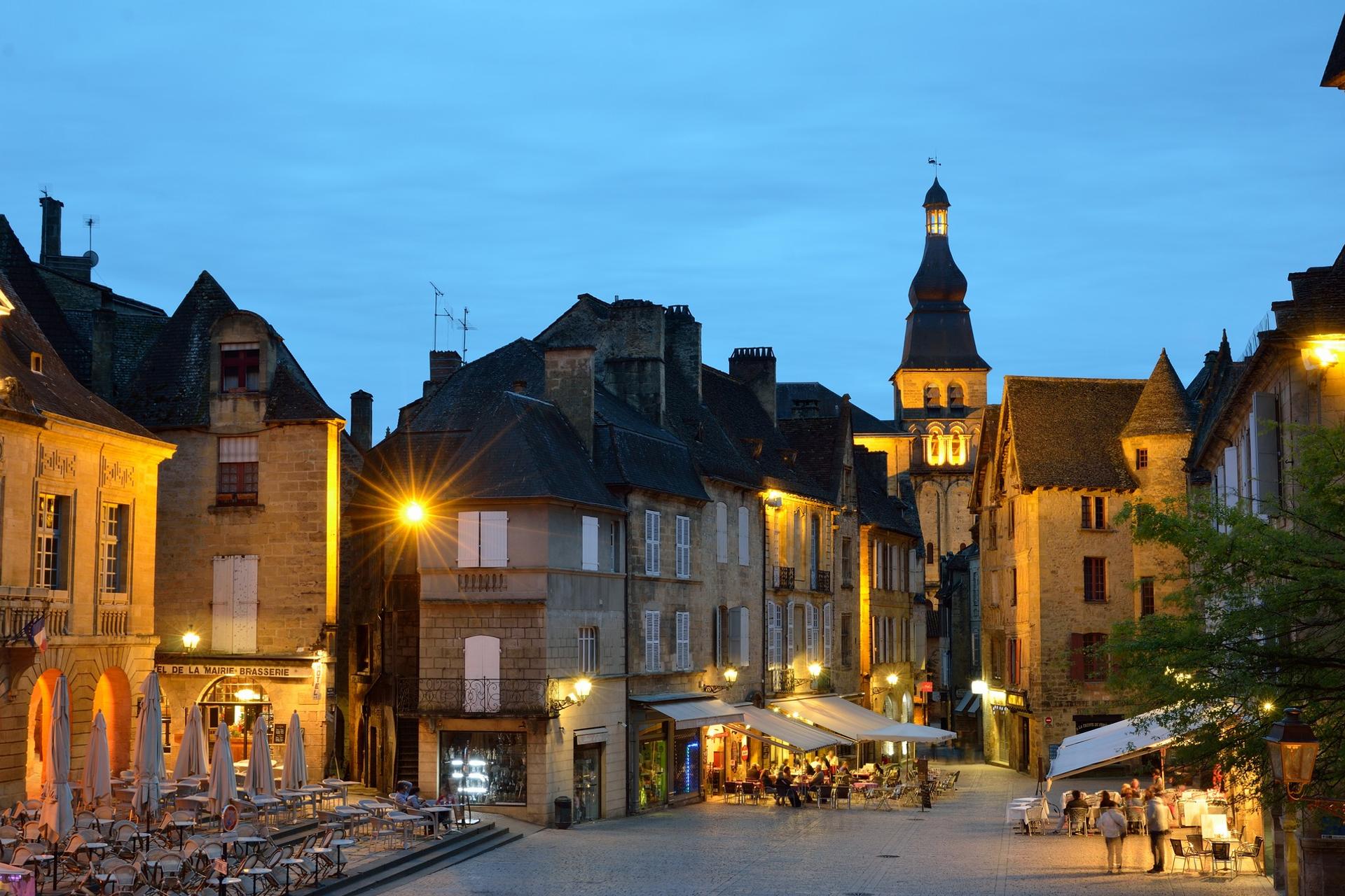 City square in Sarlat-la-Canéda at sunset time