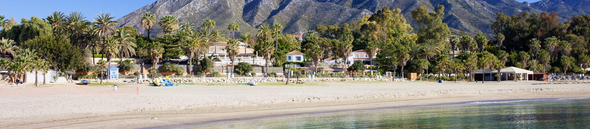 Amazing beach and mountain range in Marbella on a sunny day