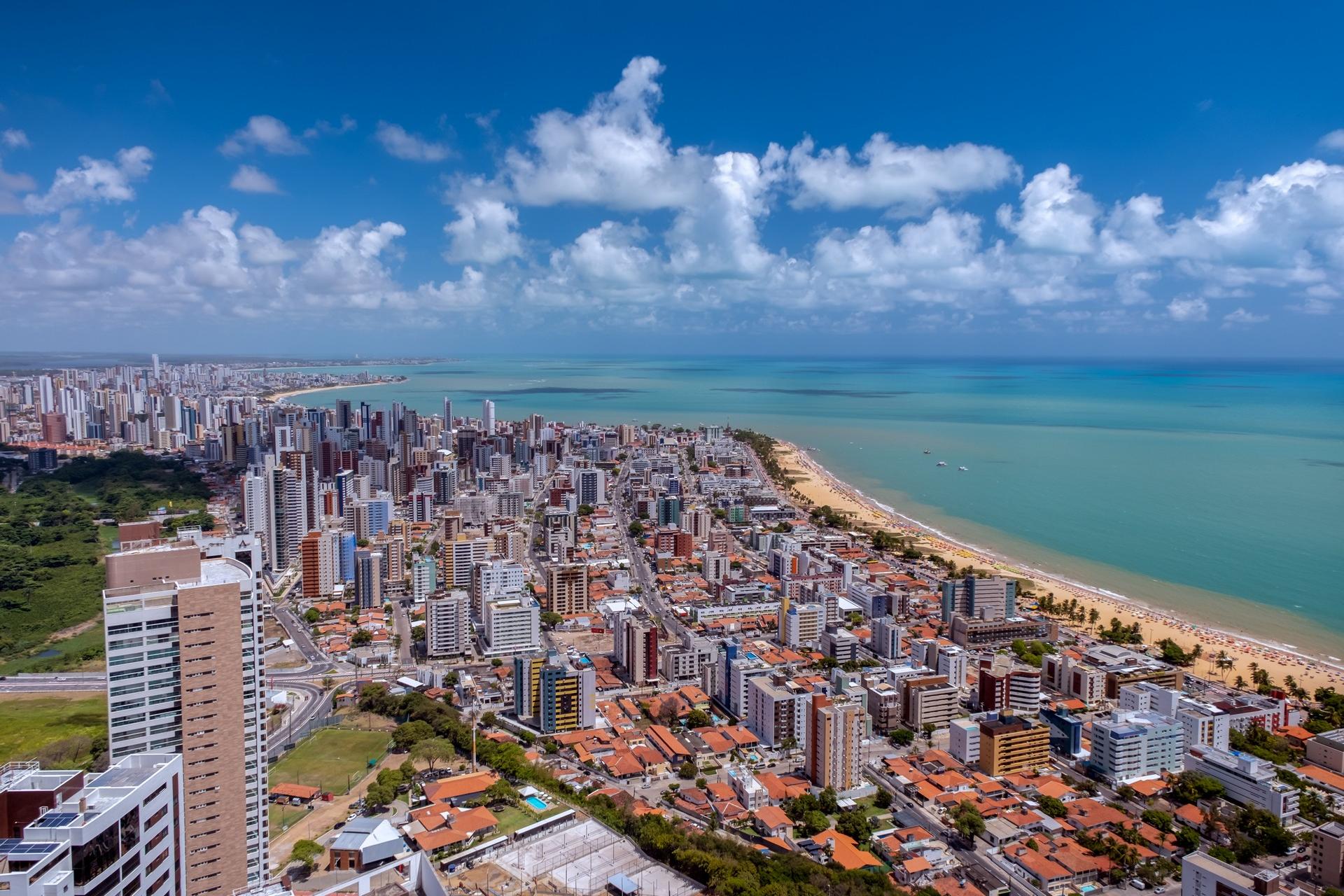 Aerial view of beach in Joao Pessoa on a sunny day with some clouds