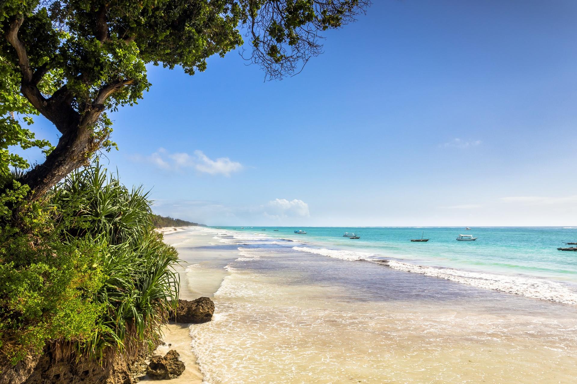 Amazing beach with turquise water in Diani Beach in partly cloudy weather